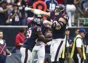 <p>Houston Texans defensive end J.J. Watt (99) celebrates after free safety Andre Hal (29) makes an interception during the first quarter against the Tennessee Titans at NRG Stadium. Mandatory Credit: Troy Taormina-USA TODAY Sports </p>