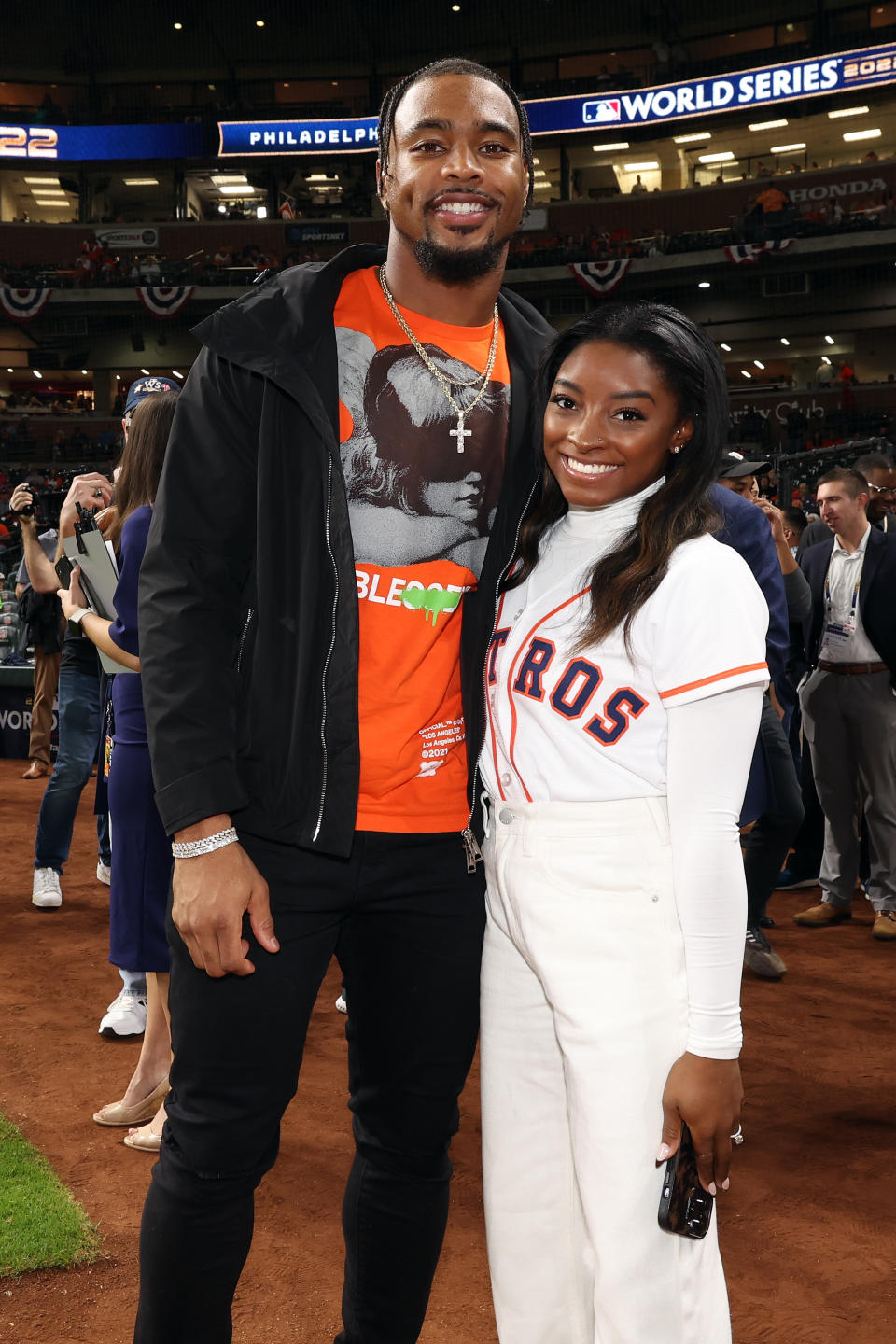 HOUSTON, TX - OCTOBER 28:  Olympic gold medalist Simone Biles and Houston Texans safety Jonathan Owens are seen prior to Game 1 of the 2022 World Series between the Philadelphia Phillies and the Houston Astros at Minute Maid Park on Friday, October 28, 2022 in Houston, Texas. (Photo by Mary DeCicco/MLB Photos via Getty Images)