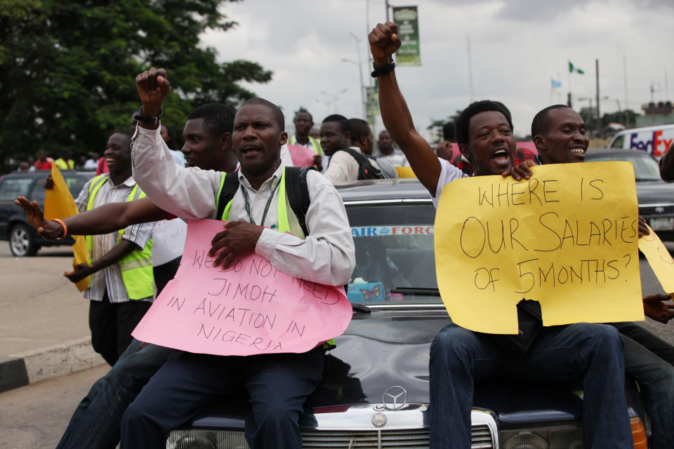 Former Air Nigeria staff protest after they were fired in Lagos, Nigeria, Friday, Sept. 7, 2012. More than 60 workers from Air Nigeria protested Friday at Lagos’ Murtala Muhammed International Airport’s domestic terminal, demanding four-months-worth of unpaid salaries from the company. The airline’s owner, business tycoon Jimoh Ibrahim, fired nearly all of the company’s 800 employees for “disloyalty” earlier this month. (AP Photo/Sunday Alamba)