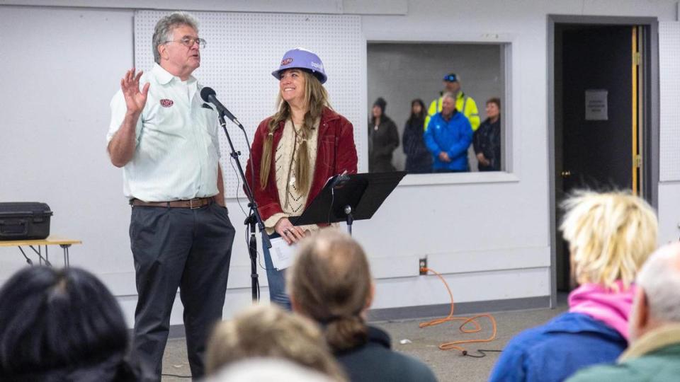 Nick Guho of Guho Construction, left, and Jodi Peterson-Stigers, Interfaith Sanctuary’s executive director, speak during a groundbreaking ceremony for the remodeling of Interfaith Sanctuary’s new homeless shelter.