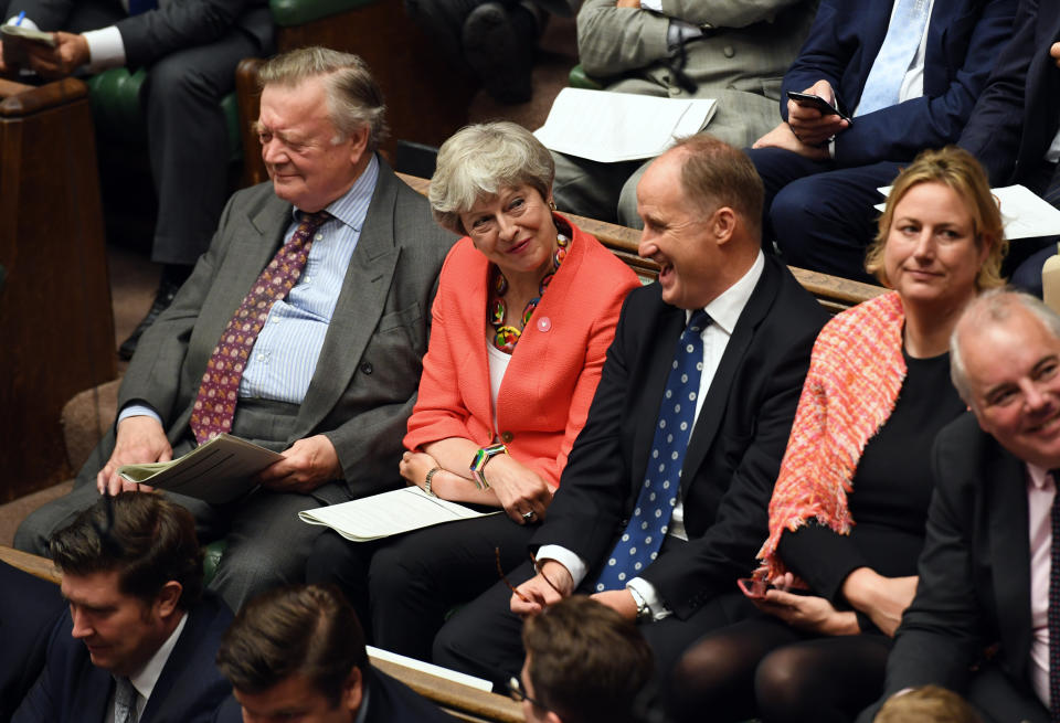 In this handout photo provided by the House of Commons, former Prime Minister Theresa May, second left, looks on during Boris Johnson's first Prime Minister's Questions, in the House of Commons in London, Wednesday, Sept. 4, 2019. Britain's Parliament is facing a second straight day of political turmoil as lawmakers fought Prime Minister Boris Johnson's plan to deliver Brexit in less than two months, come what may. Johnson is threatening to dissolve the House of Commons and hold a national election that he hopes might produce a less fractious crop of legislators. (Jessica Taylor/House of Commons via AP)