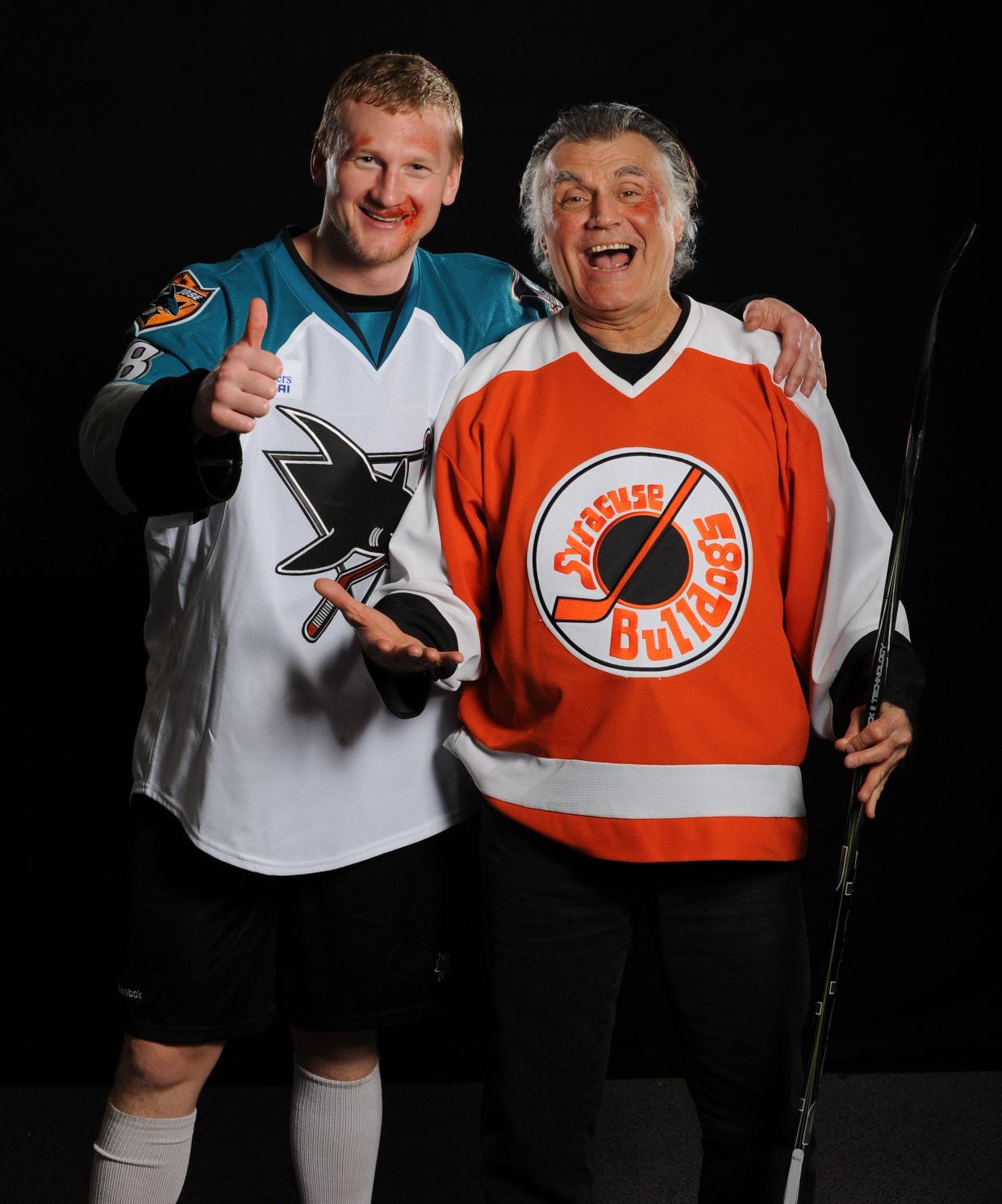 In this photo from December 2010, Worcester native Paul D'Amato, right, who played Tim "Dr. Hook" McCracken in the 1977 movie classic "Slap Shot," poses with the Worcester Sharks' Mike Moore after a photo shoot for the team's "Slap Shot" poster.