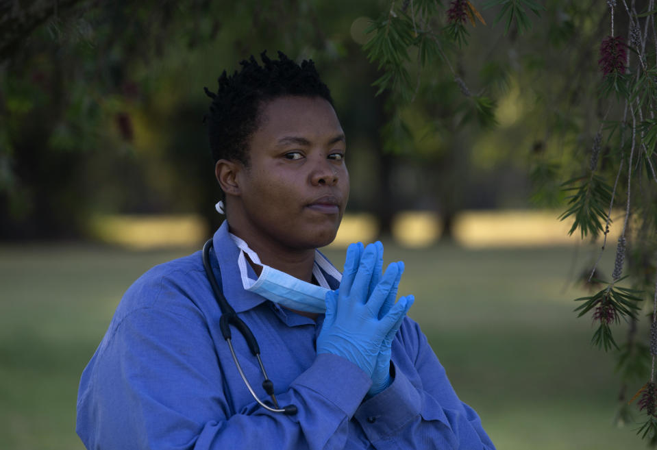 South African doctor Zolelwa Sifumba, a former TB patient, poses for a photograph, in Johannesburg, Thursday, Nov. 11, 2023. Sifumba was diagnosed with drug-resistant TB in 2012 when she was a medical student and endured 18 months of treatment taking about 20 pills every day in addition to daily injections, which left her in “immense pain” and resulted in some hearing loss. Bedaquiline was not rolled out as a standard treatment in South Africa until 2018. (AP Photo/Denis Farrell)