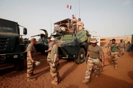 French soldiers prepare their armoured vehicles at the Relay Desert Platform Camp (PfDR) in Ansongo, Mali, October 15, 2017, during the regional anti-insurgent Operation Barkhane. REUTERS/Benoit Tessier