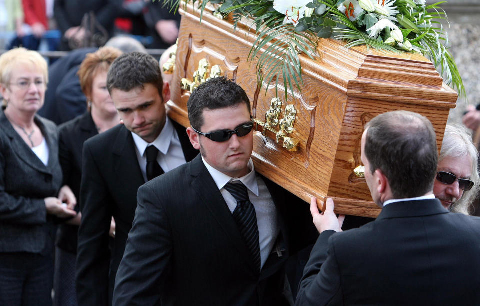 Robert Dunlop's son Michael (front left) carries his father coffin for burial, at Garryduff Presbyterian church near Ballymoney, Co Antrim.   (Photo by Paul Faith - PA Images/PA Images via Getty Images)