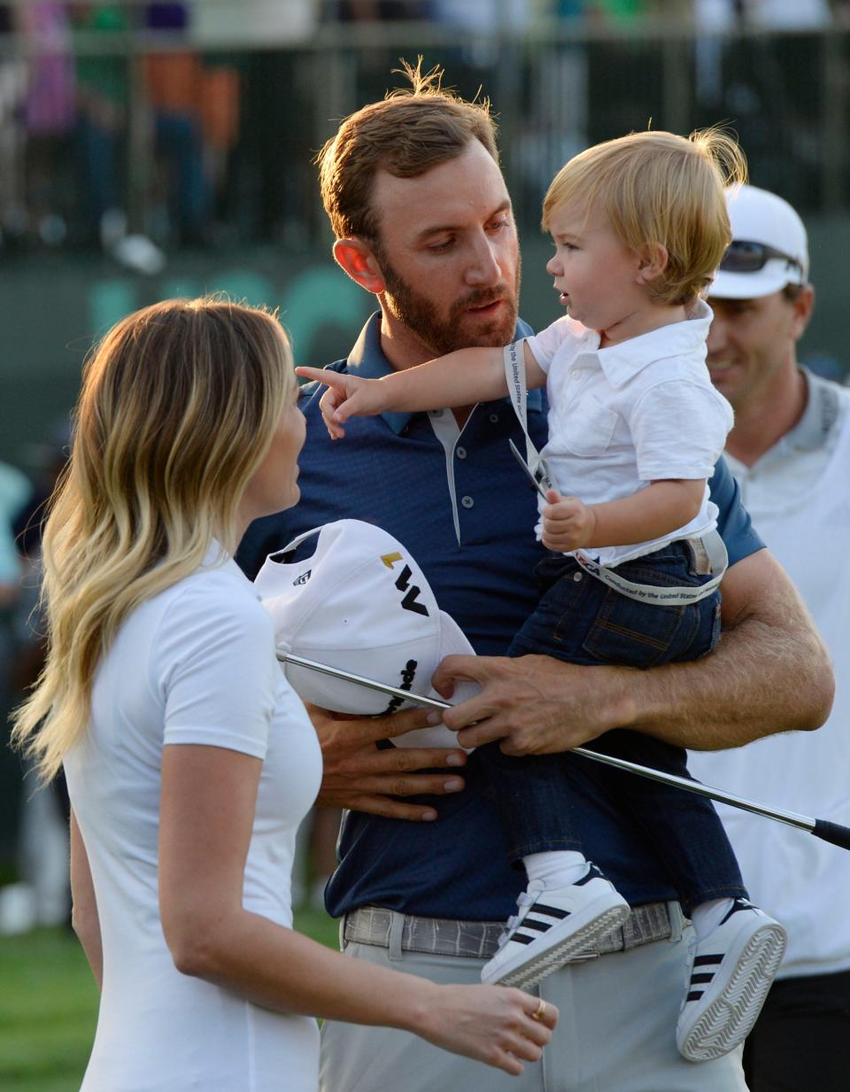 Dustin Johnson celebrates with Paulina Gretzky while holding son Tatum after winning the 2016 U.S. Open.