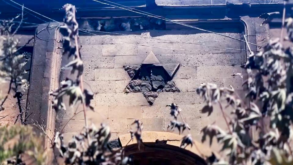 FILE - In this photo taken from video released by The Telegram Channel of the head of the Dagestan Republic of Russia on Monday, June 24, 2024, a damaged Star of David is seen on the wall of the the Kele-Numaz synagogue in Derbent, Russia. Jews in the predominantly Muslim region of Dagestan in southern Russia say they are determined to regroup and rebuild following a deadly attack by Islamic militants on June 23 on Christian and Jewish houses of worship in Derbent and the regional capital of Makhachkala. (The Telegram Channel of the head of Dagestan Republic of Russia via AP, File)
