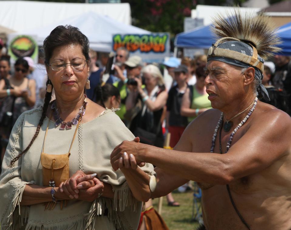 The last day of the 2015 Mashpee Wampanoag Powwow. From left: Marlene Lopez with the Mashpee Wampanoag tribe and Jim Peters, of the Mashpee Wampanoag, dancing the two-step in East Falmouth. Steve Haines/Cape Cod Times