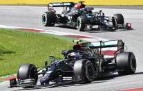 Mercedes driver Valtteri Bottas of Finland steers his car followed by Mercedes driver Lewis Hamilton of Britain during the Austrian Formula One Grand Prix at the Red Bull Ring racetrack in Spielberg, Austria, Sunday, July 5, 2020. (Joe Klamar/Pool via AP)