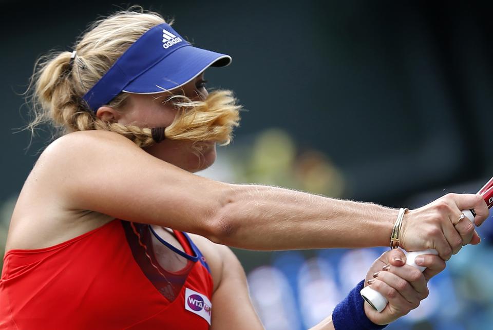 Kerber of Germany returns a shot against Kvitova of the Czech Republic during their singles final match at the Pan Pacific Open tennis tournament in Tokyo