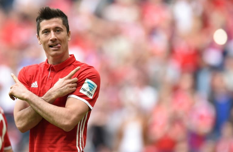 Bayern Munich striker Robert Lewandowski celebrates after scoring against Augsburg on April 1, 2017