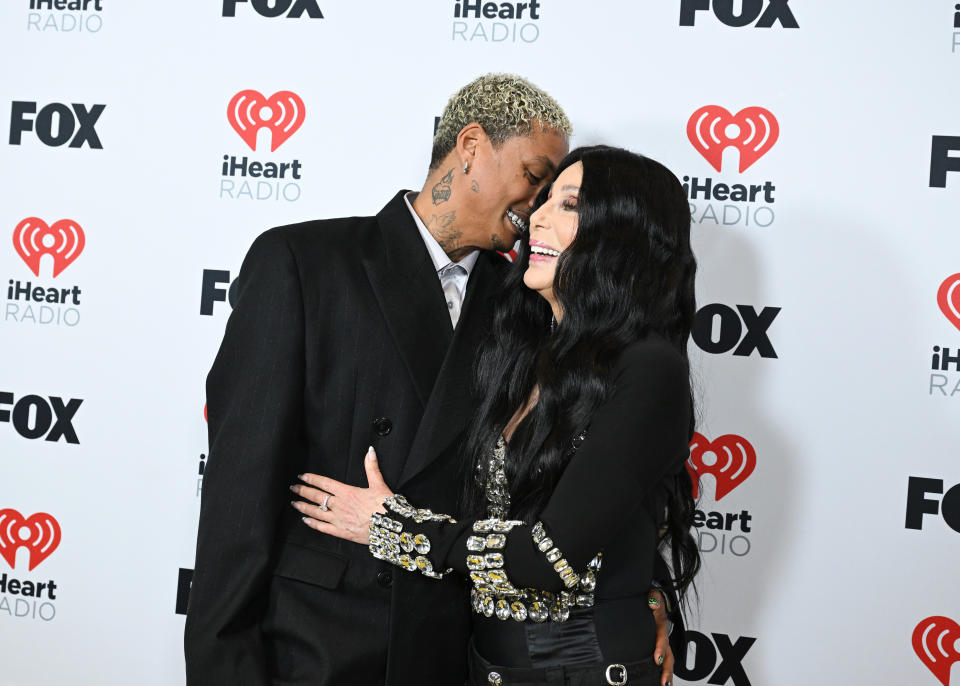 Alexander "AE" Edwards and Cher, winner of the Icon award, pose in the press room at the 2024 iHeartRadio Music Awards held at the Dolby Theatre on April 1, 2024 in Los Angeles, California. (Photo by Gilbert Flores/Billboard via Getty Images)