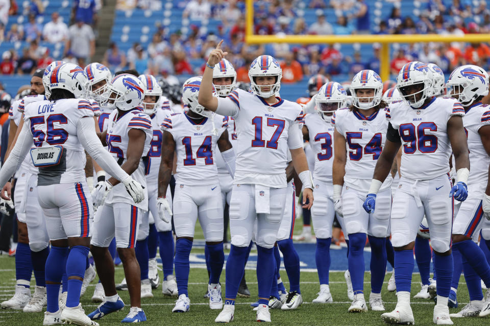 Buffalo Bills quarterback Josh Allen (17), center, warms-up before a preseason NFL football game against the Denver Broncos, Saturday, Aug. 20, 2022, in Orchard Park, N.Y. (AP Photo/Jeffrey T. Barnes)