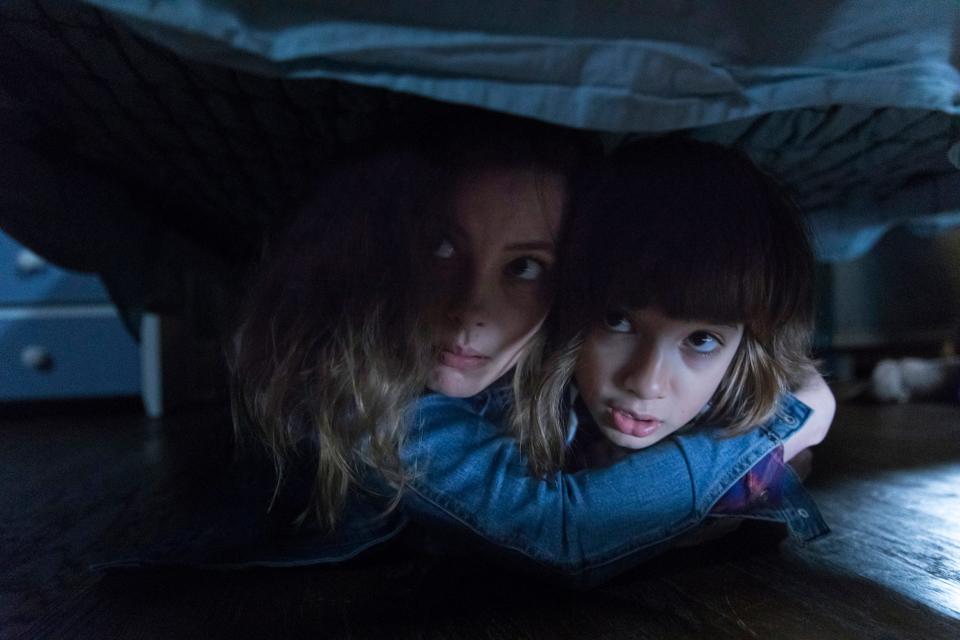 A mom (Gillian Jacobs) tries to protect her son (Azhy Robertson) when their electronic devices are invaded by a terrifying monster in "Come Play."