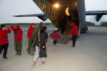 Canadian Armed Forces evacuates people from a wildfire in Pikangikum First Nation