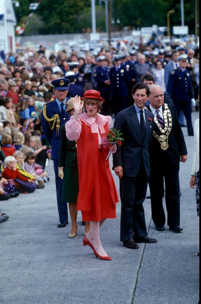 <p>Diana and Charles head to Hobart, Tasmania, where she wears a red Bellville Sassoon suit and John Boyd hat.<br></p>