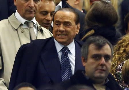 AC Milan's president and former Italian Prime Minister Silvio Berlusconi arrives before the match against Fiorentina at San Siro stadium in Milan, October 26, 2014. REUTERS/Stefano Rellandini/Files