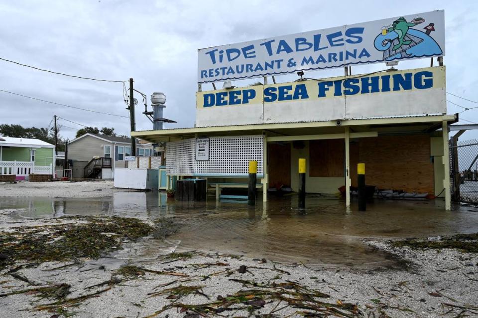 Waters swirl around Tide Tables at Cortez after Hurricane Idalia passed on August 30, 2023.
