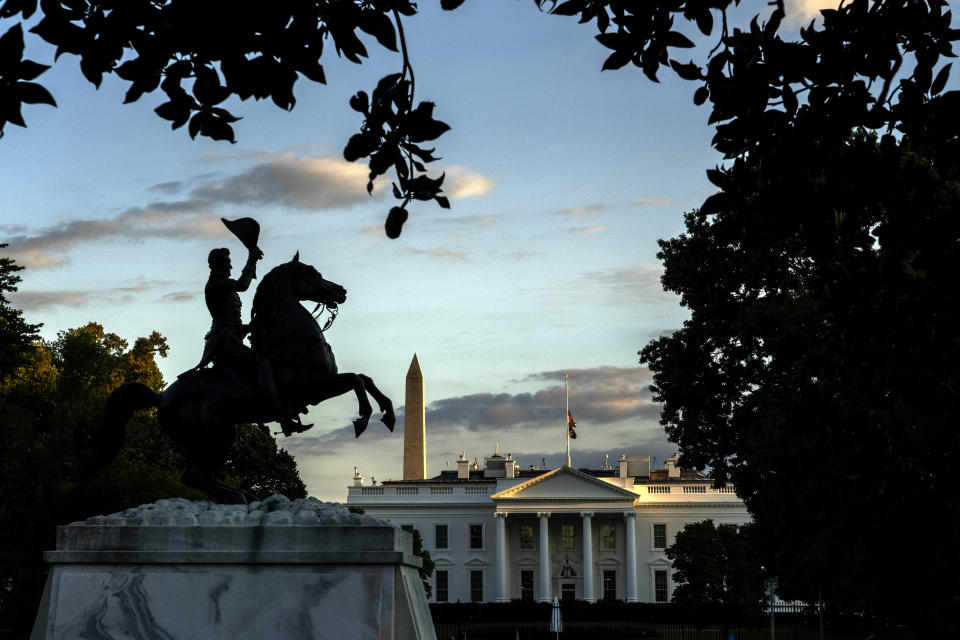 With the equestrian statue of President Andrew Jackson in Lafayette Park in the foreground, the American flag flies at half-staff over the White House, Thursday, Sept. 8, 2022, in Washington, after Queen Elizabeth II, Britain's longest-reigning monarch and a rock of stability across much of a turbulent century, died Thursday after 70 years on the throne. She was 96. (AP Photo/Gemunu Amarasinghe)