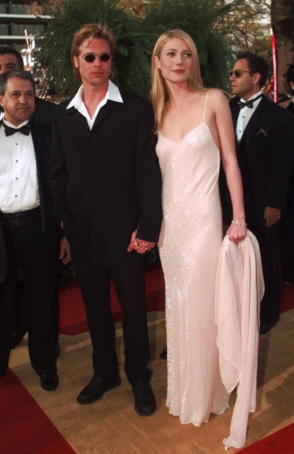 Actress Gwyneth Paltrow and actor Brad Pitt arrive at the Academy Awards in Los Angeles, March 25, 1996. (AP Photo/Kevork Djansezian)