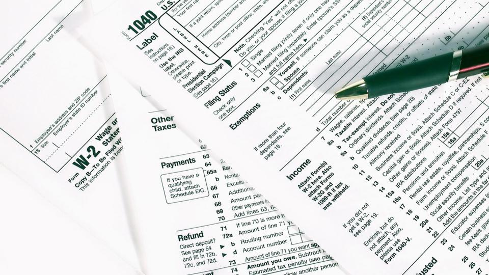 Federal tax forms 1040 and W-2 from the US Department of the Treasury.