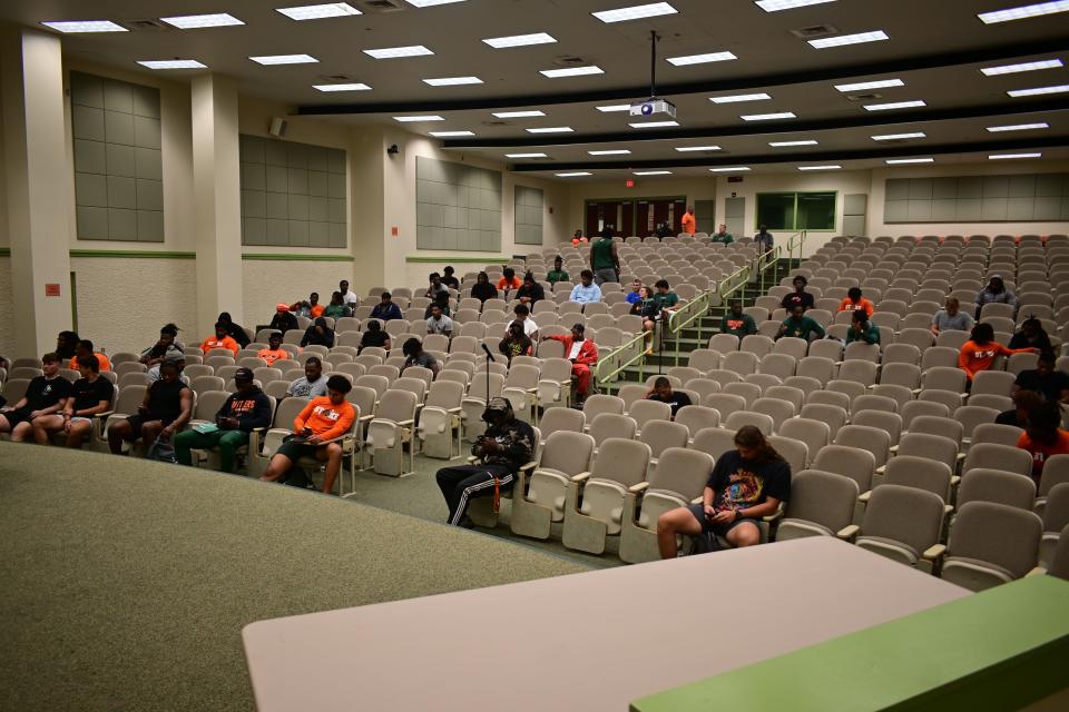 Florida A&M Rattlers players and coaches begin to pack campus' College of Pharmacy and Pharmaceutical Sciences lecture hall for the first team meeting of fall football training camp in Tallahassee, Florida, Wednesday, Aug. 2, 2023