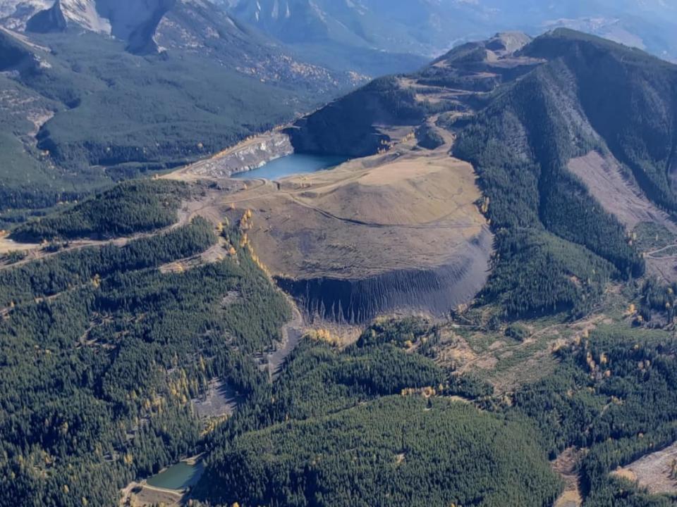 An aerial view of Tent Mountain in southwestern Alberta, which was the site of an open-pit coal mine that was active decades ago but has since been abandoned. Montem Resources now aims to use the site for a pumped-hydro energy storage project. (Montem Resources - image credit)