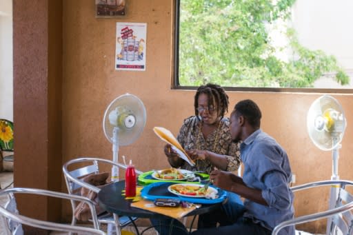 Yaisah Val lunches with her husband Richecarde Val, a couple combatting homophobia and transphobia in conservative Haiti