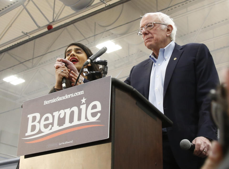 Democratic presidential candidate Sen. Bernie Sanders I-Vt., has his remarks interrupted by a protestor, left, during his campaign event in Carson City, Nev.., Sunday, Feb. 16, 2020. (AP Photo/Rich Pedroncelli)