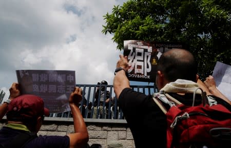 Demonstrators march to protest against the Yuen Long attacks in Yuen Long