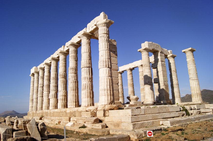 In this Dec. 12, 2016 photo, the Temple of Poseidon, an ancient hilltop structure in the southern peninsula of Sounion dedicated to the god of the sea is shown. For travelers with more than beaches on their minds, there's plenty of upside to a brief winter visit to Athens that avoids the crowds and heat of summer. (Jerrin Heller via AP)