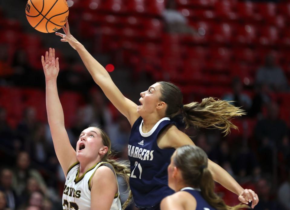 Davis High School’s Kate Richards shoots as Corner Canyon’s Maia Rhay guards her during a 6A girls quarterfinal basketball game at the Huntsman Center in Salt Lake City on Monday, Feb. 26, 2024. Corner Canyon won 59-56 in overtime. | Kristin Murphy, Deseret News