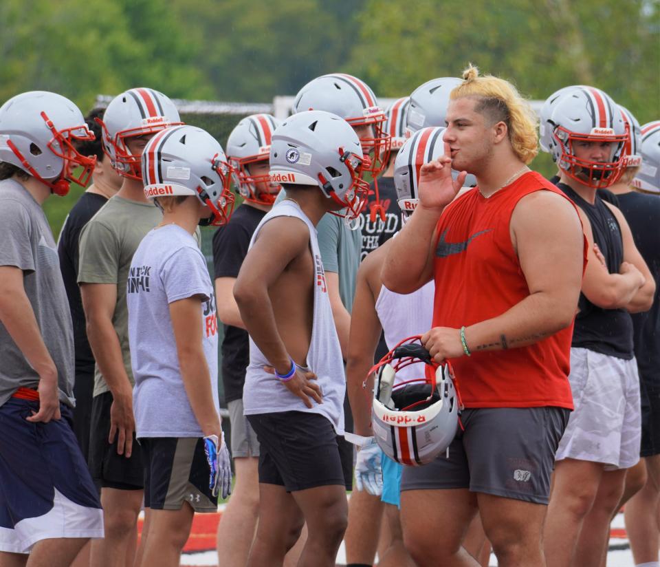Somers lineman Jake Polito makes sure teammates are keep the chatter to a minimum and paying attention to coach Anthony DeMatteo on Day of 1 practice on August 22, 2022.
