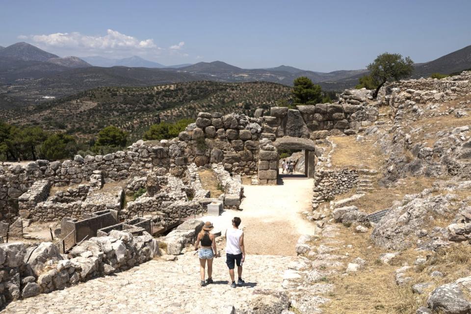 <div class="inline-image__caption"><p>Tourists walk towards the Lion Gate of Mycenae at the archaeological site of Mycenae, Greece, on Monday July 27, 2020. </p></div> <div class="inline-image__credit">Konstantinos Tsakalidis/Bloomberg via Getty Images</div>