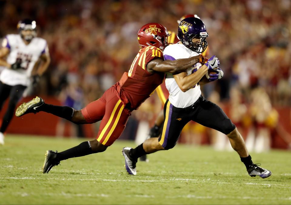 AMES, IA – SEPTEMBER 2: Wide receiver Isaiah Weston #80 of the Northern Iowa Panthers is tackled by defensive back Brian Peavy #10 of the Iowa State Cyclones as he rushed for yards in the first half of play at Jack Trice Stadium on September 2, 2017 in Ames, Iowa. (Photo by David Purdy/Getty Images)