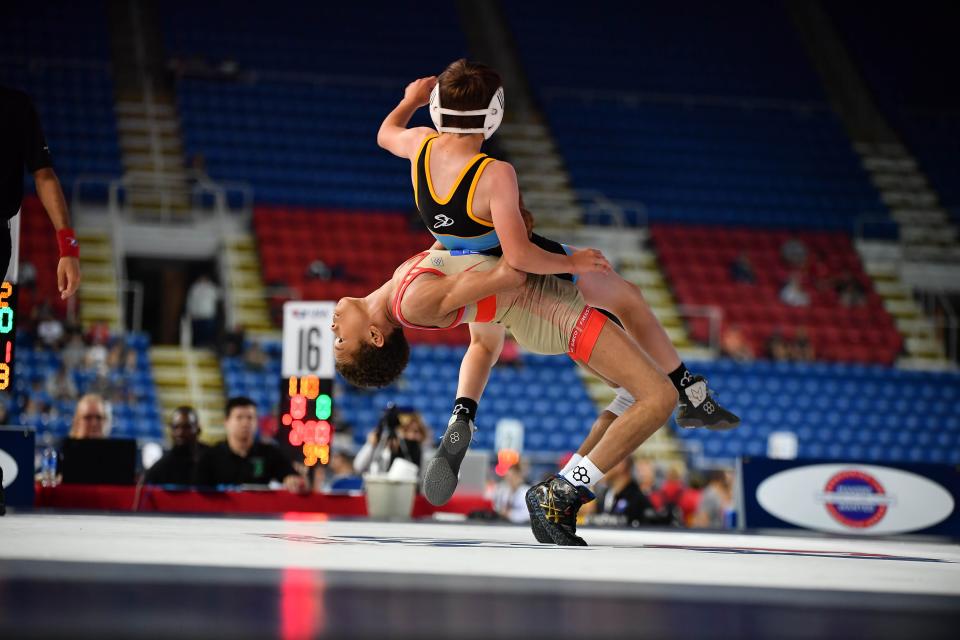 Javaan Yarbrough (bottom) throws South Dakota's Tyler Trant during action in the 16U Greco-Roman National Tournament at Fargo, N.D. on Wednesday. [Travis Le/MatFocus.com photo]