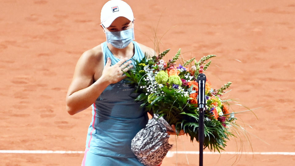 Ash Barty, pictured here with a bouquet of flowers for her 25th birthday.