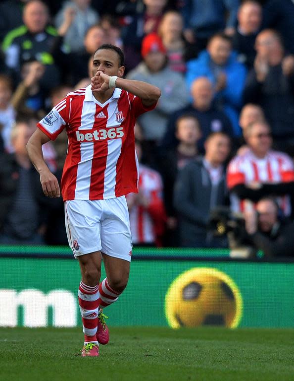 Stoke City's Peter Odemwingie celebrates after scoring during their Premier League match against Hull City in England, on March 29, 2014