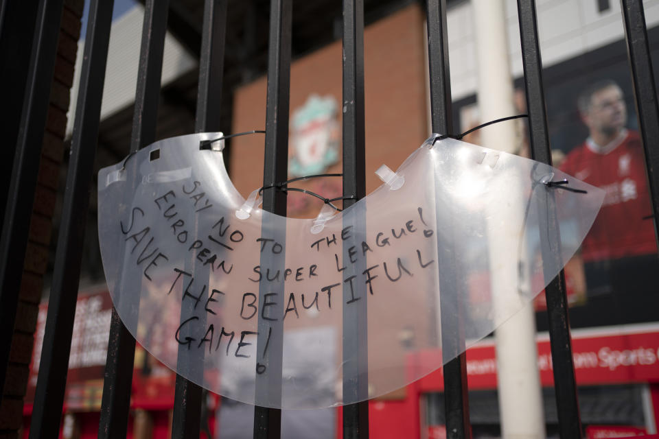 A sign is seen outside Liverpool's Anfield Stadium after the collapse of English involvement in the proposed European Super League, Liverpool, England, Wednesday, April 21, 2021. Liverpool owner John W Henry has apologised to the club's supporters for the "disruption" caused by the proposed European Super League (ESL). (AP Photo/Jon Super)