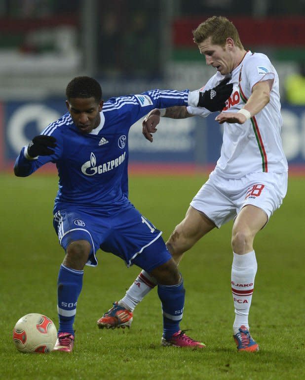 Schalke's striker Jefferson Farfan (L) and Augsburg's midfielder Andre Hahn fight for the ball during their German first division Bundesliga football match in Augsburg, southern Germany, on January 26, 2013. The match ended 0-0