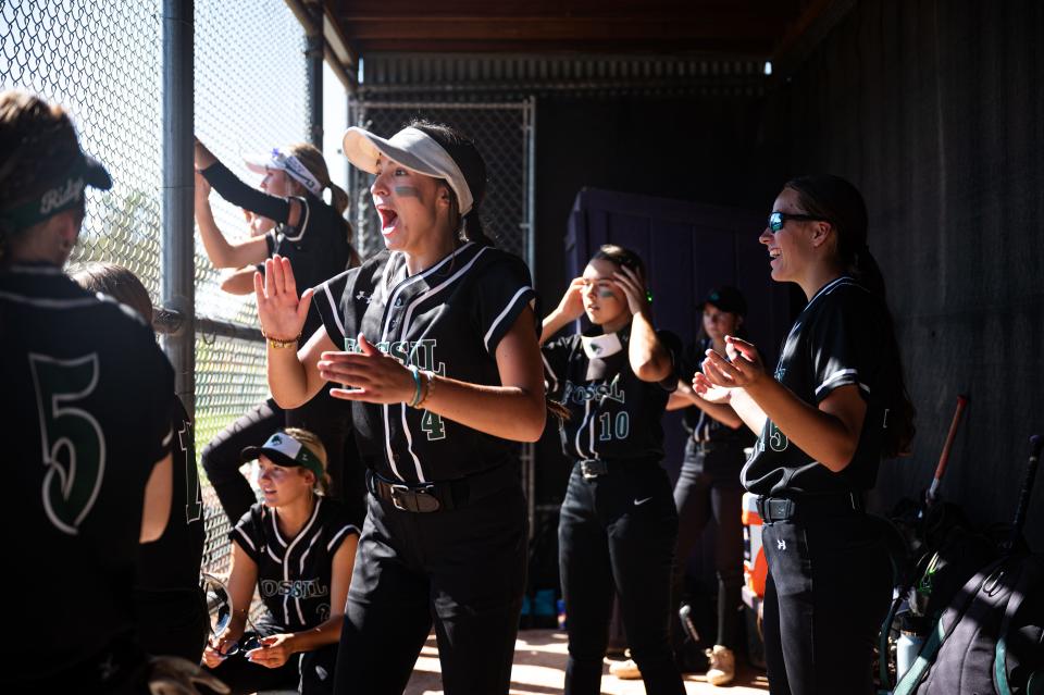 Fossil Ridge softball players celebrate in the dugout during their game against Fort Collins High School on Saturday, Sept. 9. Fossil won 9-2.