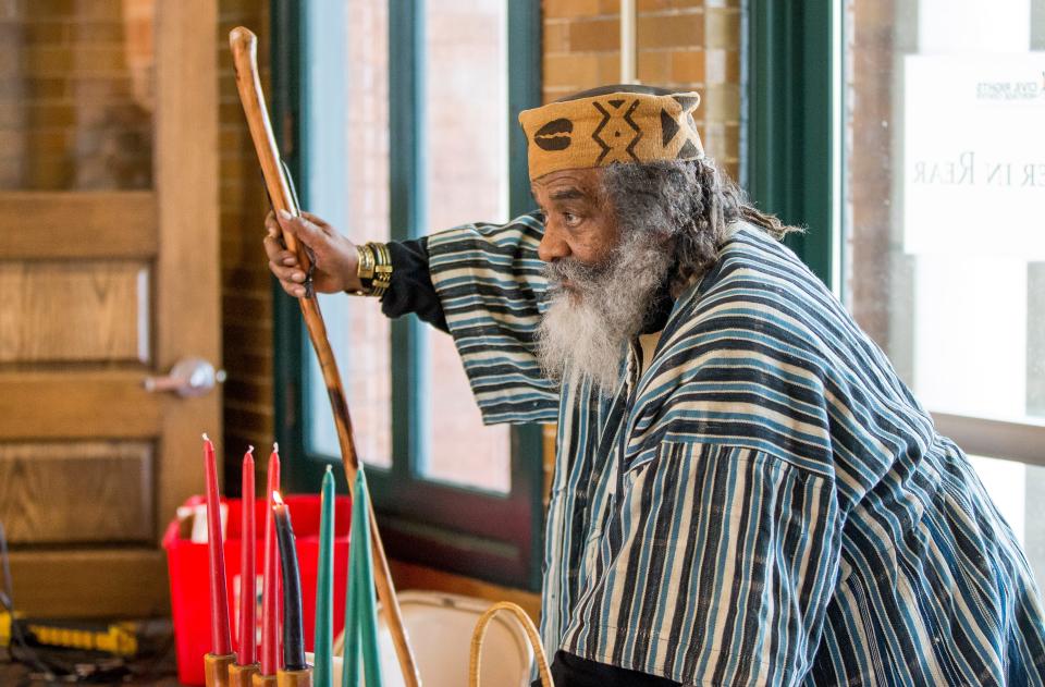 In this file photo from December 2016,  Verge “Brother Sage” Gillam speaks of the seven principles of Kwanzaa. He helped to popularize the holiday in South Bend by moving it from St. Augustine Catholic Church to Century Center and opening it to the whole community.