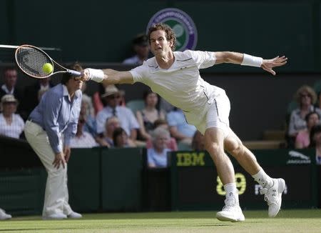 Andy Murray of Britain hits a shot during his match against Andreas Seppi of Italy at the Wimbledon Tennis Championships in London, July 4, 2015. REUTERS/Henry Browne