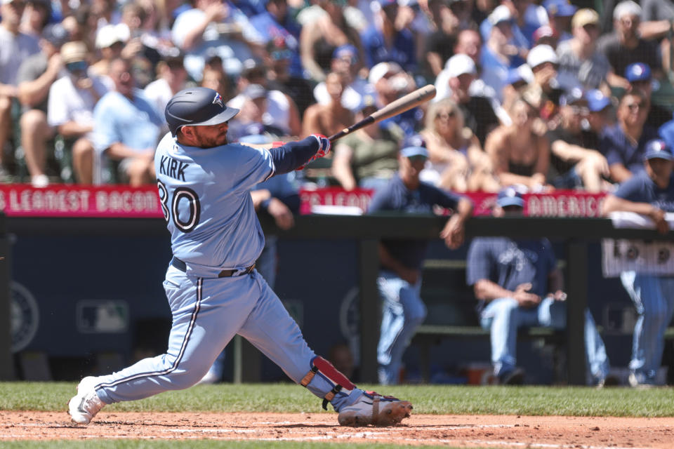 Toronto Blue Jays' Alejandro Kirk follows through on a single in the fourth inning of a baseball game against the Seattle Mariners, Saturday, July 22, 2023, in Seattle. (AP Photo/Jason Redmond)