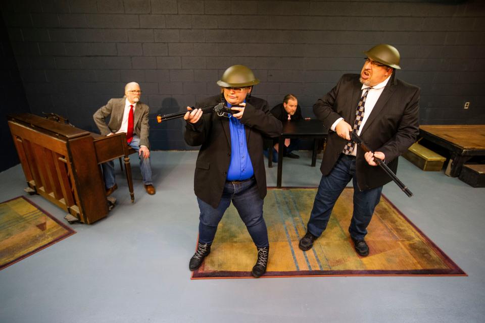 Cecil Eastman, left, Emily Clarkson, Michael Clarkson and Russell Pluta rehearse for The Acting Ensemble's production of the 1960 British sketch comedy revue "Beyond the Fringe" at the theater in Mishawaka.