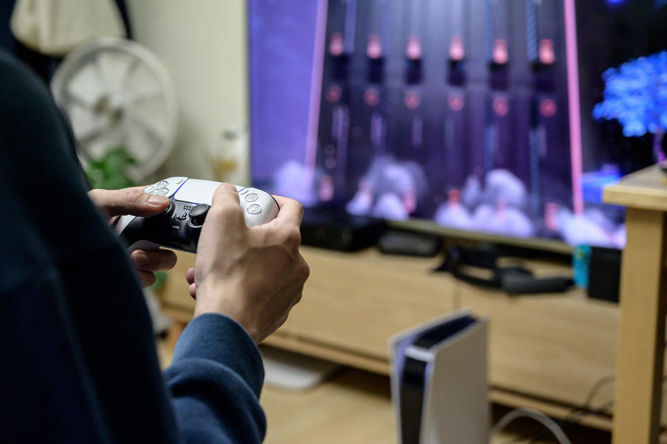 In a photo taken on November 12, 2020, a gamer plays on the new Sony Playstation PS5 at his home in Seoul after Sony launched the new console in select markets around the world. (Photo by Yelim LEE / AFP) (Photo by YELIM LEE/AFP via Getty Images)