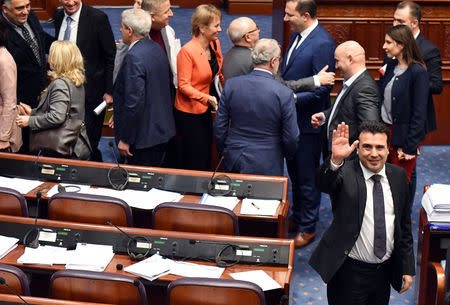 Macedonian Prime Minister Zoran Zaev greets the press after deputies of the Macedonian parliament vote to pass constitutional changes to allow the Balkan country to change its name to the Republic of North Macedonia, in Skopje, Macedonia, January 11, 2019.REUTERS/ Tomislav Georgiev