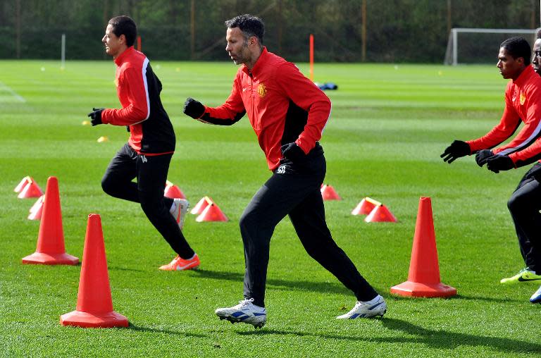 Ryan Giggs (centre) takes part in a training session at the Carrington complex on April 8, 2014