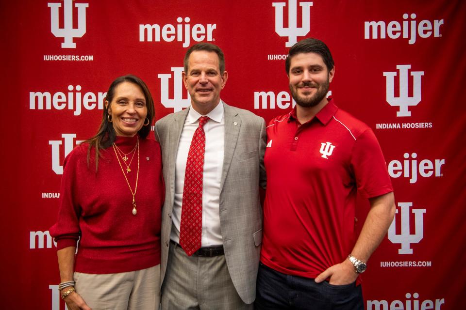 Indiana's newly announced head coach of football Curt Cignetti, middle, his wife Manette L. Cignetti, left, and son Curtis Cignetti, right, pose together on Friday, Dec. 1, 2023. Cignetti is the 30th football coach in the university's history.