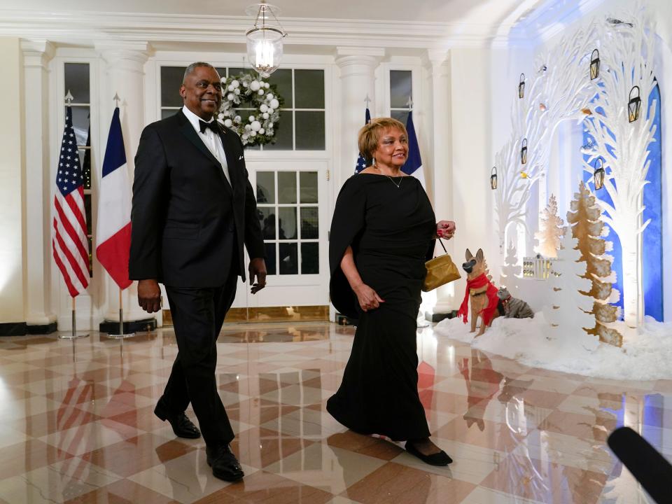 Defense Secretary Lloyd Austin and his wife Charlene Austin arrive for the State Dinner with President Joe Biden and French President Emmanuel Macron at the White House in Washington, Thursday, Dec. 1, 2022.